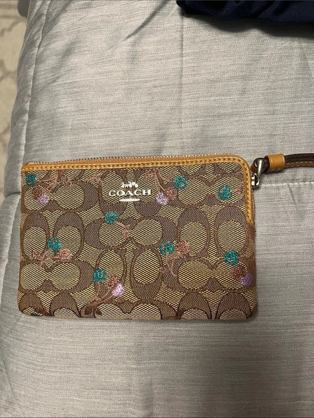 COACH Signature Canvas Floral Wristlet in Brown